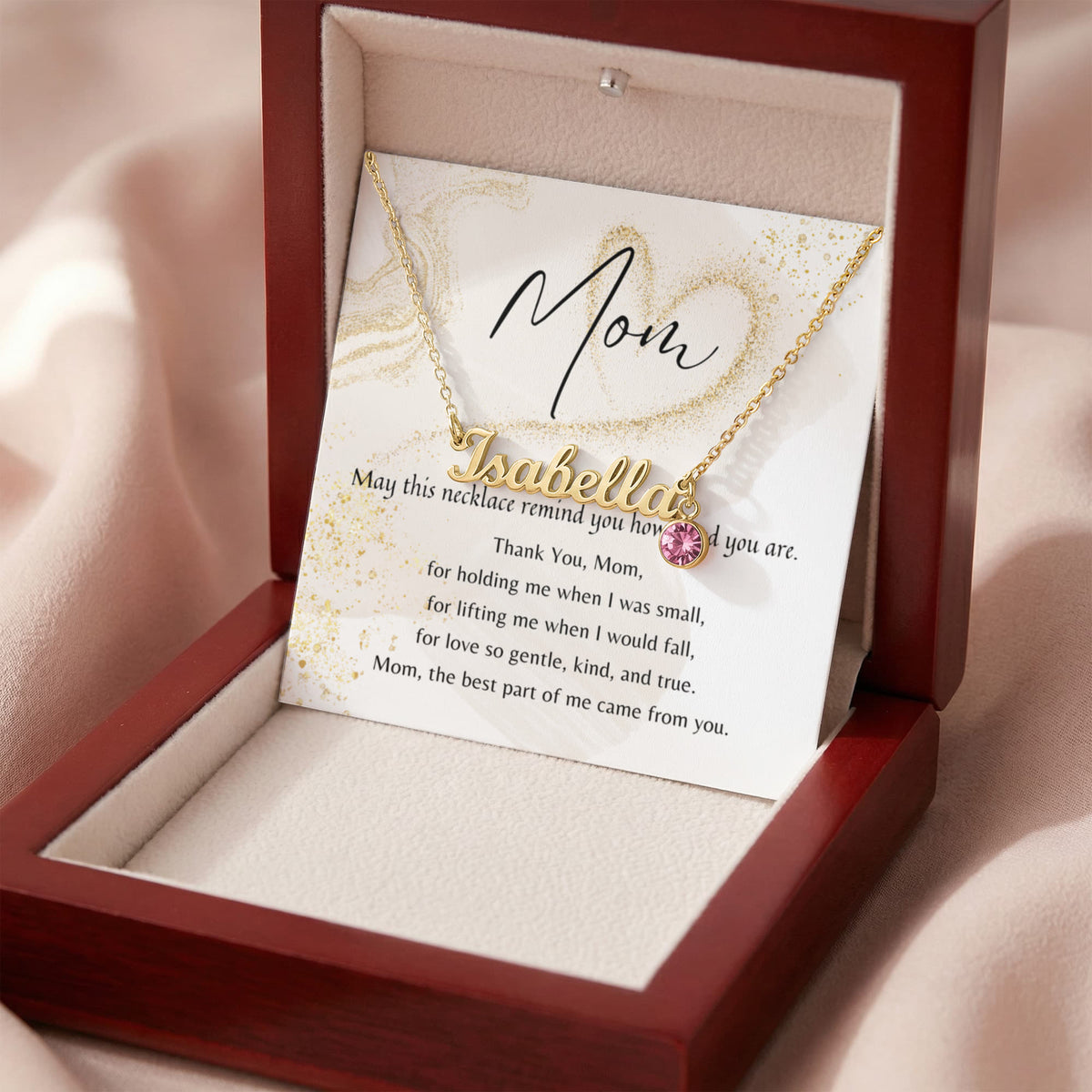 Custom Name Necklace with Birthstone for Mom – A Meaningful Gift of Love | gold finish name pendant with pink birthstone in wooden box