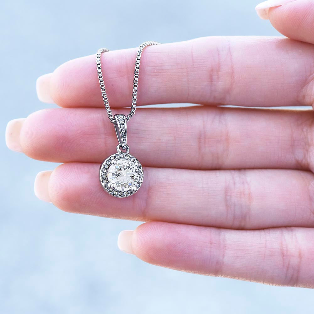 Eternal Hope Necklace for Bride – 14k White Gold Plated with sparkling pendant held between fingers, a meaningful gift for the bride