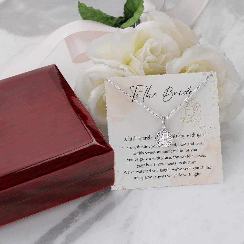 Eternal Hope Necklace for Bride – 14k White Gold Plated with gift box, elegant pendant displayed on a marble surface with white roses
