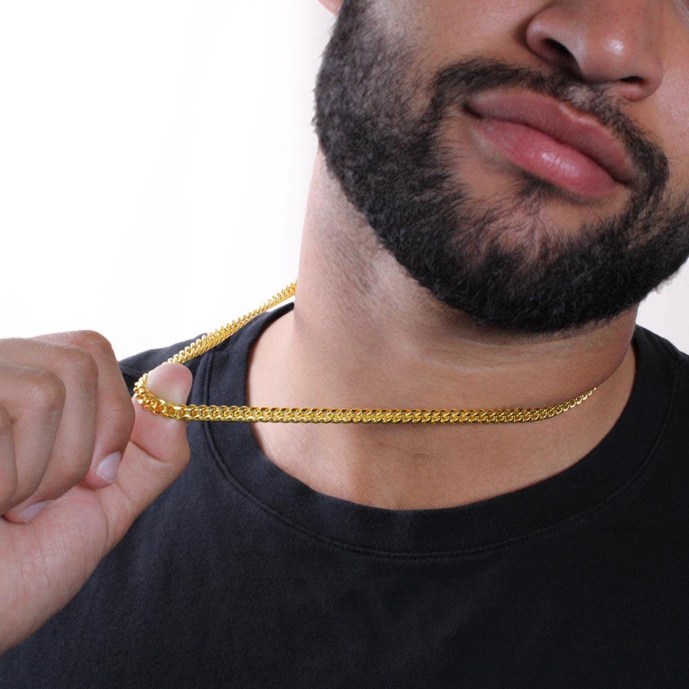 Cuban Link Chain for Son – Meaningful Gift from Mom or Dad worn by man holding gold chain near neck
