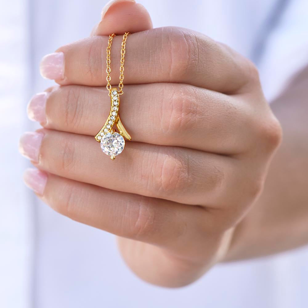 Alluring Beauty Necklace for Sister – 14k White Gold or 18k Yellow Gold Plated held in hand showcasing sparkling pendant design
