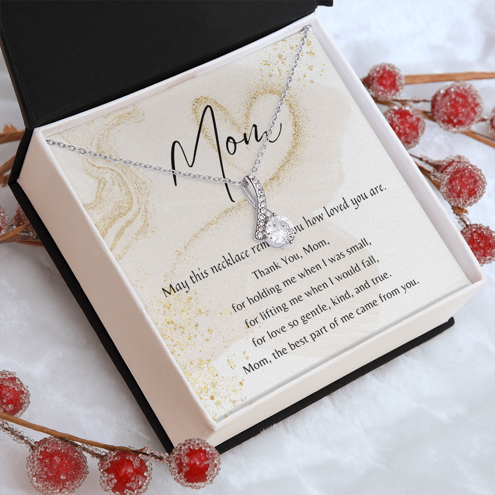 Elegant heart-shaped cubic zirconia necklace in white gold finish presented in a gift box with a heartfelt poem for Mom.