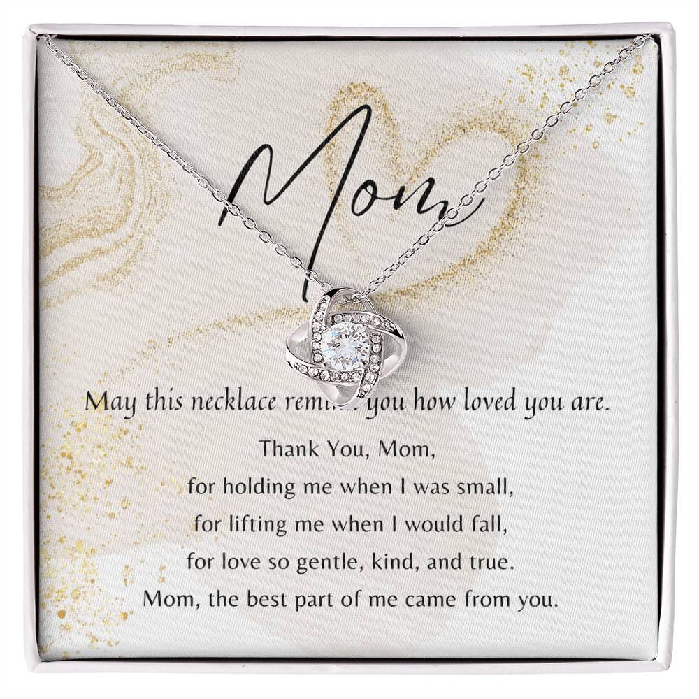Love Knot Necklace in white gold plated with cubic zirconia, displayed in a gift box with a heartfelt poem for Mom.