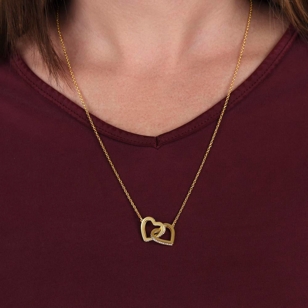 Interlocking Hearts Necklace for Grandma – A Meaningful Gift for Grandma | Rose Gold or 18K Yellow Gold Plated worn on model with burgundy top