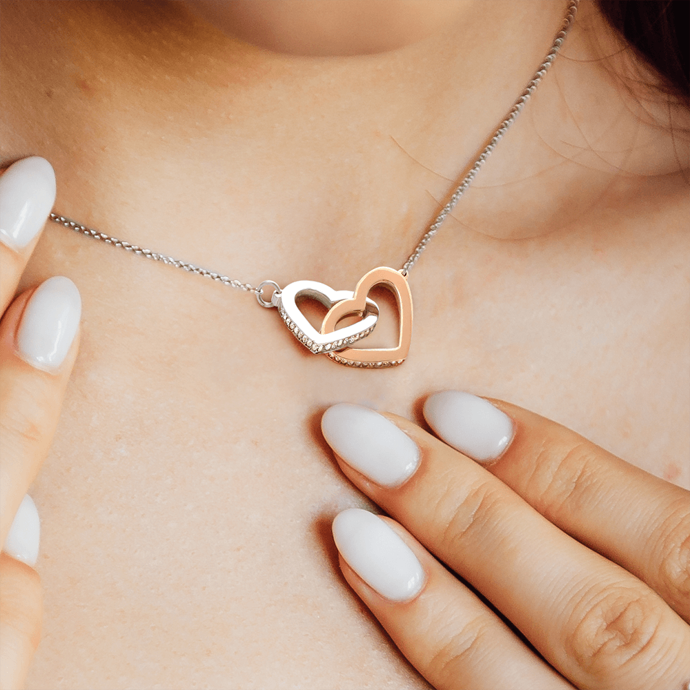 Interlocking Hearts Necklace for Daughter – Rose Gold or 18k Yellow Gold Plated meaningful gift worn on neck with hand nearby