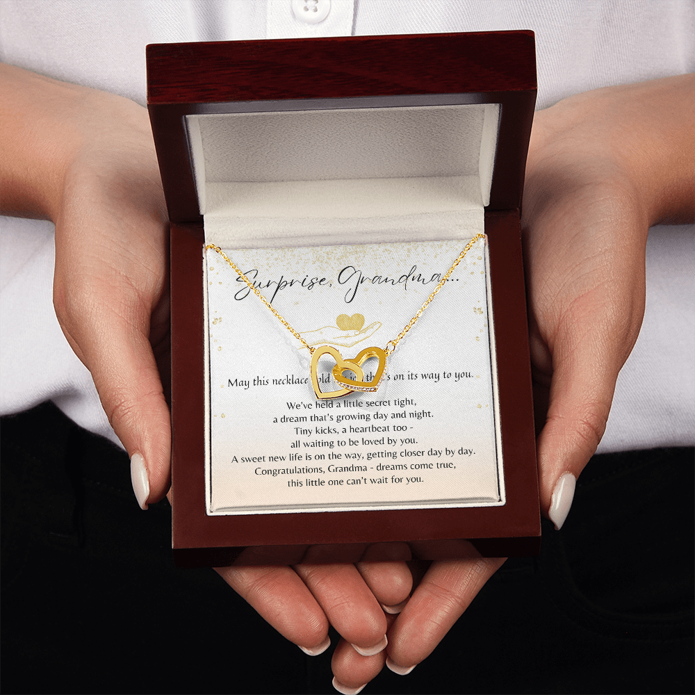 Interlocking Hearts Necklace for Grandma-To-Be – A Meaningful Baby Announcement Gift for Grandma | Rose Gold or 18K Yellow Gold Plated in presentation box held in hands