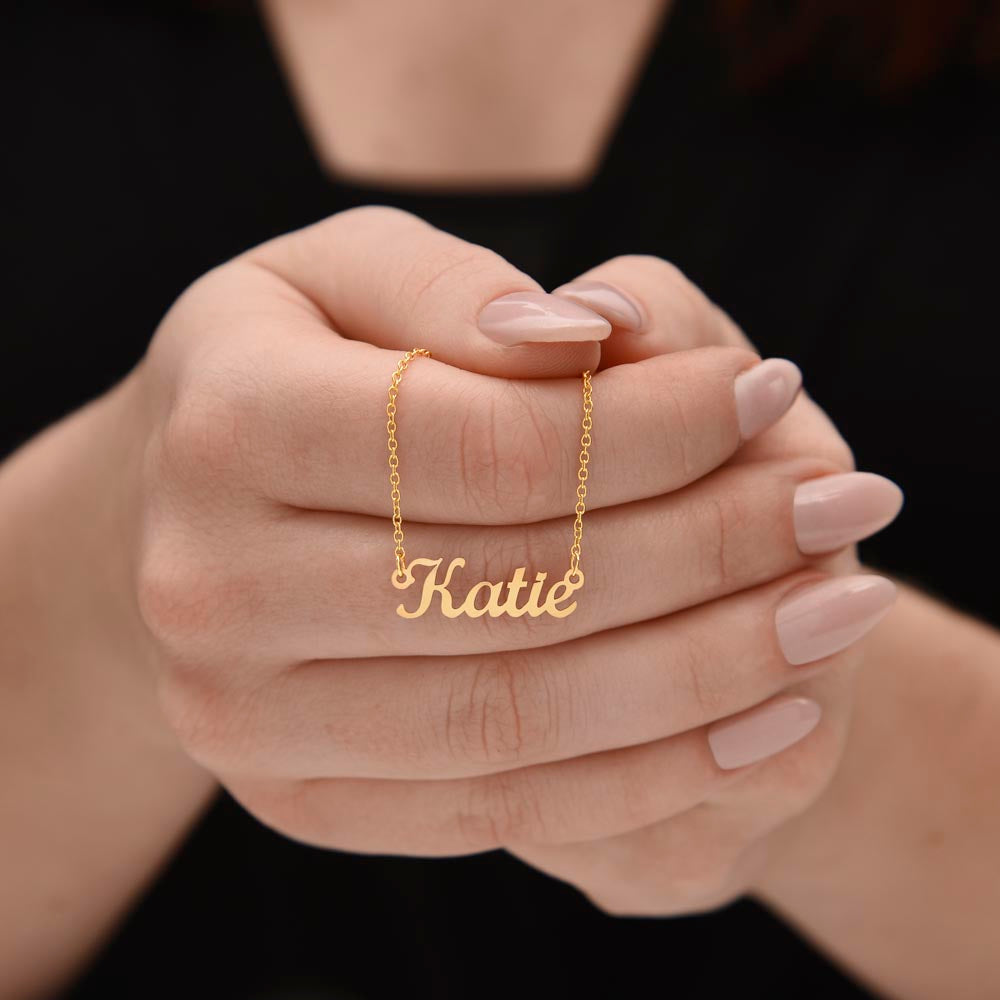 Custom Name Necklace for Daughter – A Meaningful Gift from Parent | delicate 18k yellow gold finish name necklace held in hands