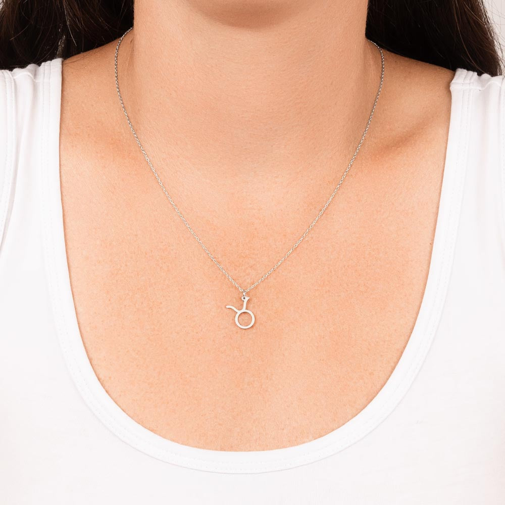 Taurus Zodiac Necklace for Women – Astrology Gift with silver symbol pendant on delicate chain worn over white top