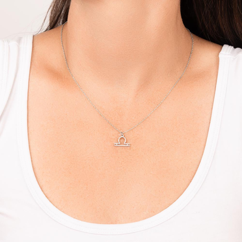 Libra Zodiac Necklace for Women – Astrology Gift featuring a silver symbol pendant worn on a delicate chain against white top