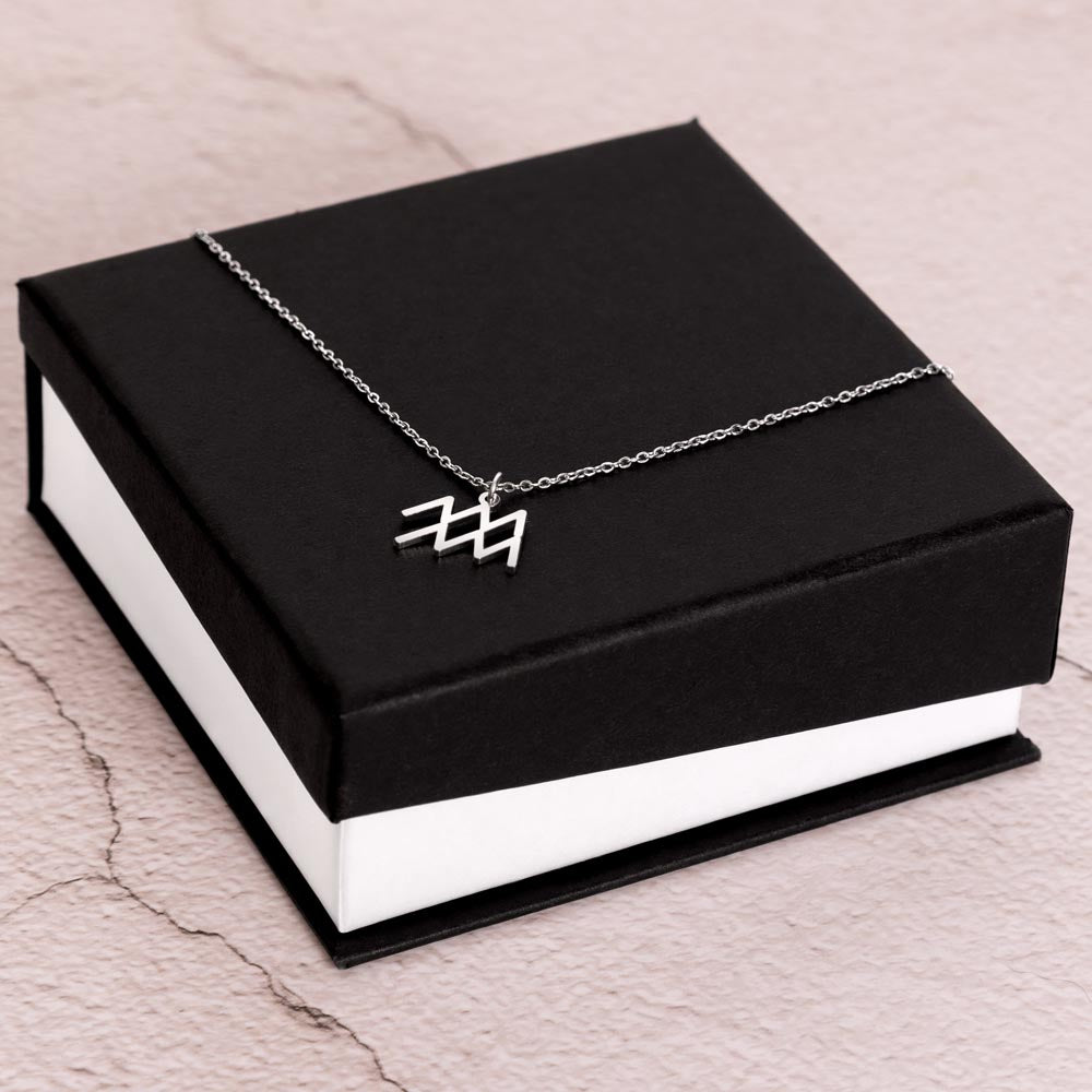 Aquarius Zodiac Necklace for Women – Astrology Gift with silver zodiac pendant displayed on black and white gift box