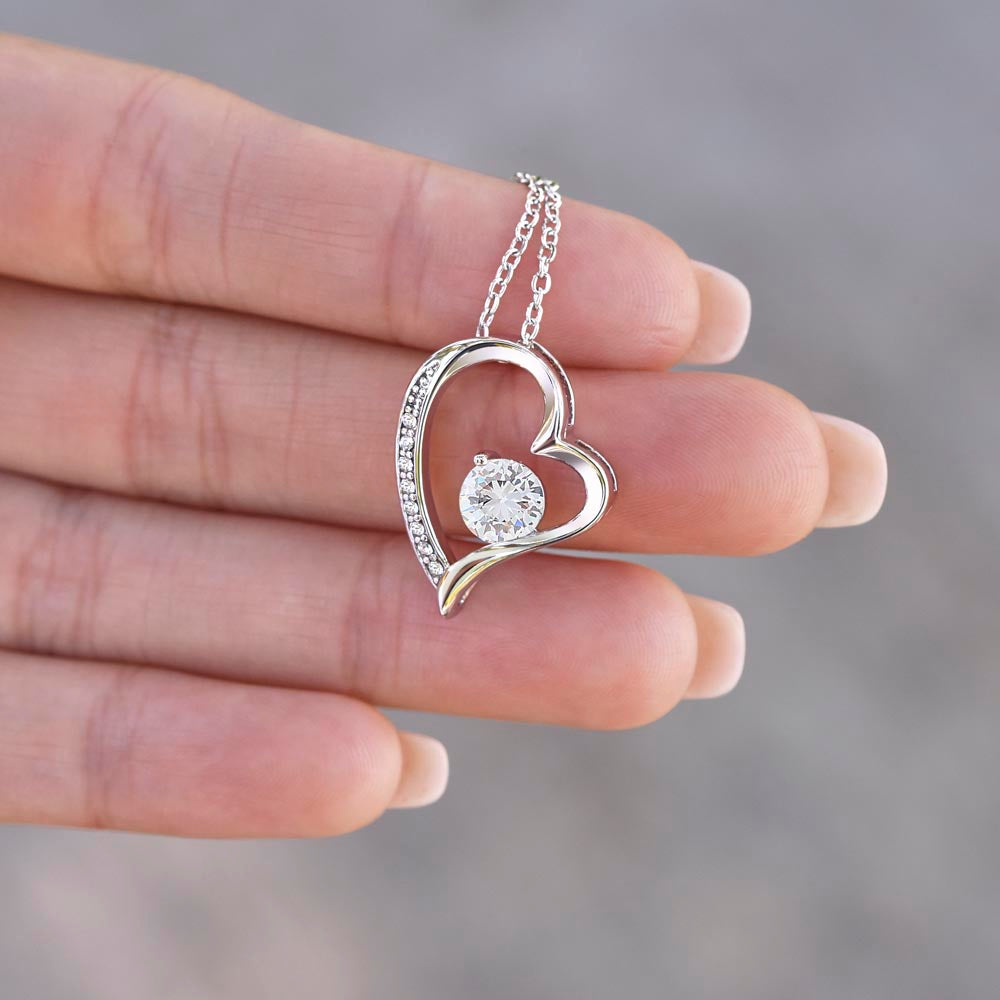 Forever Love Necklace for Her – 14k White Gold or 18k Yellow Gold Plated heart pendant held in hand, elegant gift jewelry